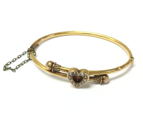 A 15ct gold antique bangle set with seed pearls ,8.3g postage category A