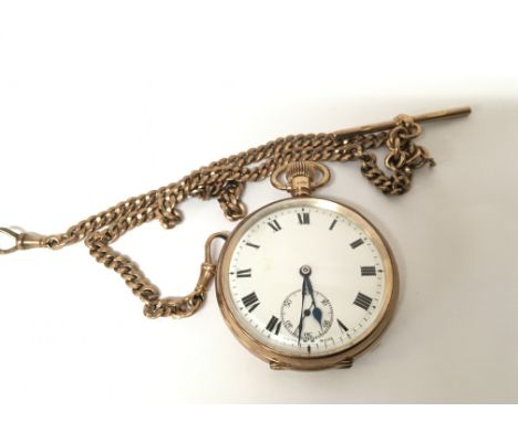 A 9carat gold button wind pocket watch with attached 9carat gold chain the watch with an enamel dial seen working and no pers
