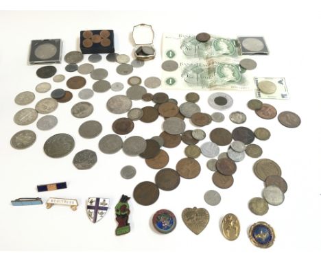 An assorted collection of coinage including half crowns and Ã‚Â£1 notes. Also contains enamel badges, Postage B