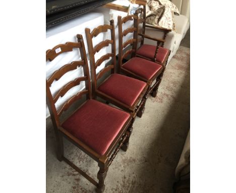 A SET OF 4 OAK LADDER BACK CHAIRS