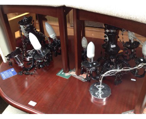 A PAIR OF BLACK CHANDELIER LIGHT FITTINGS