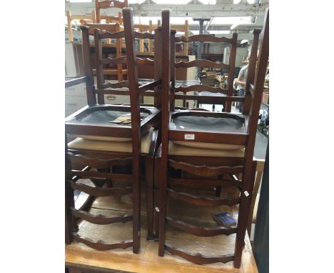 A SET OF 4 OAK LADDER BACK CHAIRS