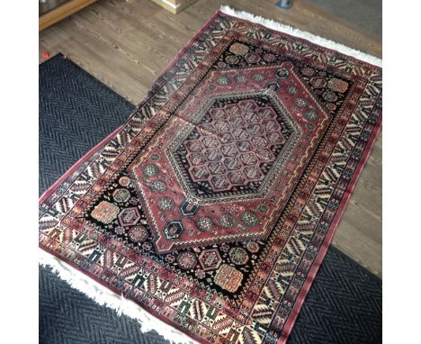 An eastern carpet. 126cm x 195cm