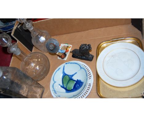 A box of miscellaneous china and glass ware to include Hummel style continental figure, a carved and polished figure of a lio
