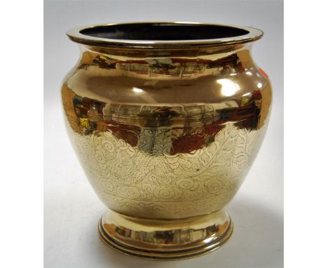 A Chinese brass jardinere of squat circular form with incised dragon and a pearl decoration with character mark, height 25cm
