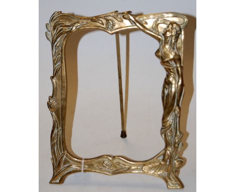 An Art Nouveau style cast brass easel photograph frame, decorated with robed maiden within foliage, outer dimensions 32 x 25c