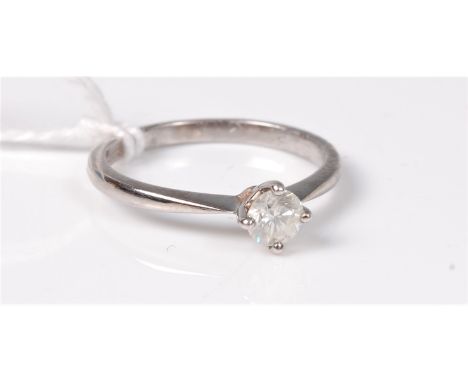 An 18ct white gold single stone diamond ring, he round brilliant cut diamond, estimated approx. 0.30cts, in a four claw mount