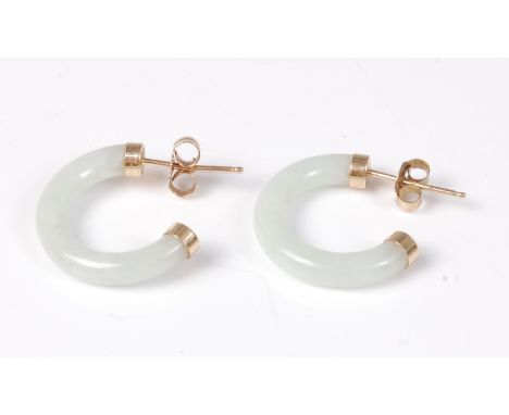 A pair of jade earhoops, approx. 1.9cm diameter, with 9ct caps to both ends and 9ct posts