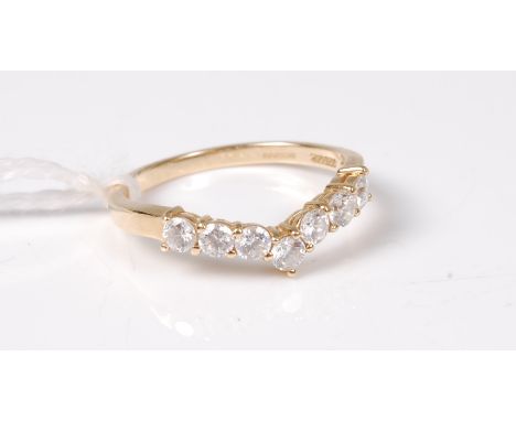 A 14ct CZ wishbone ring, the round CZ's all claw set to a plain band hallmarked Birmingham 2001, size T, (2.9g)