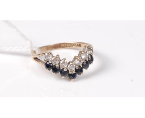 A 9ct sapphire and CZ wishbone ring, hallmarked London1991, size K, (1.8g)