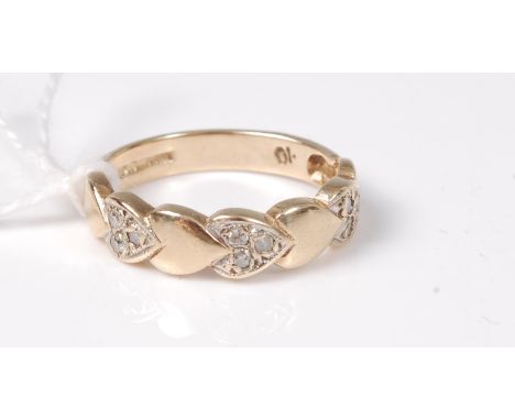A 9ct diamond ring, half the band set with small heart shapes, each alternate heart set with three small round diamonds, tota