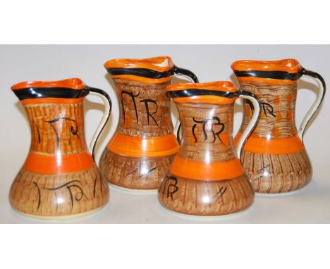 A set of four Myott & Son painted ceramic single handled jugs, each having pinched spouts and of tapering lower bulbous form,