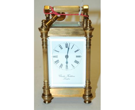 A 20th century lacquered brass cased carriage clock, the enamelled dial with Roman numerals, signed Charles Frodsham of Londo