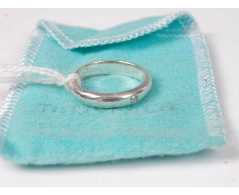 A Tiffany & Co. silver ring set with a single small white hardstone, size P, with dust bag (3.9g)