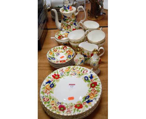 An early 20th century 6 place setting tea service with floral decoration, heightened in gilt