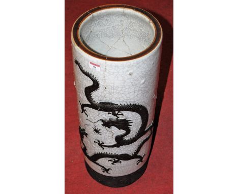 An early 20th century Japanese crackle glazed stickstand, relief decorated with dragons chasing a mythical pearl (heavily dam