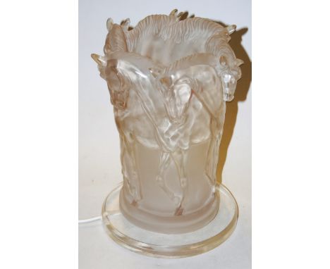 A modern resin table lamp in the form of entwined horses on circular perspex base, height 31cm