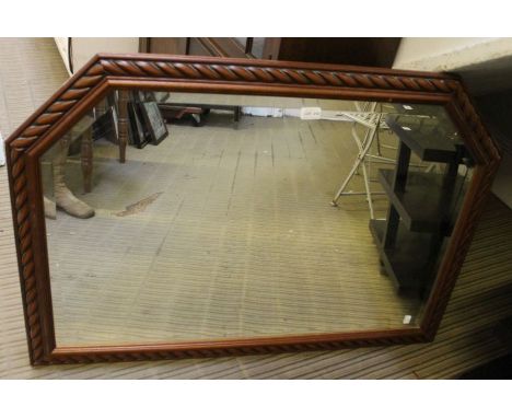 A Large modern carved over mantle mirror.