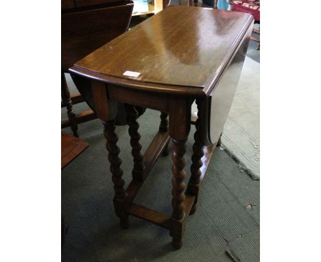 A small gate leg table with barley twist legs