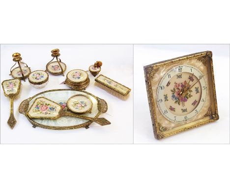 Gilt metal and tapestry dressing table set viz:- clock, pair candle holders, brushes, tray, pots, perfume spray, etc. (11)