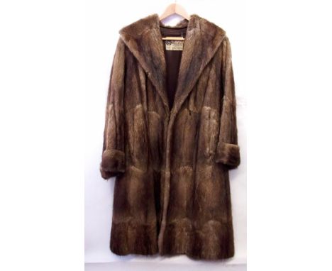A full length vintage fur coat, possibly musquash, by Marcus of London, Edinburgh and Newcastle upon Tyne (ss) 