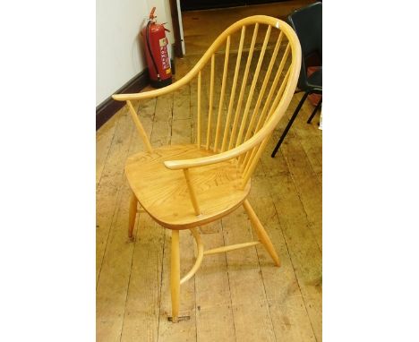 A set of six Ercol hoop and stickback arm chairs with crinoline stretchers
