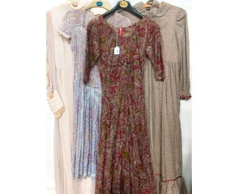 A Sambo County Clothes of Cheltenham cotton paisley maxi dress, another cotton maxi dress, a pair of bridesmaids dresses circ