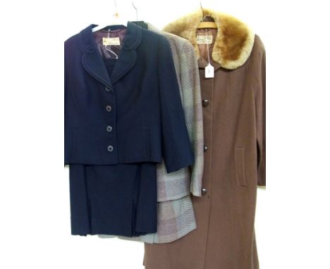 A brown wool coat by Warwick House of Malvern, button front and a faux fur collar, a Warwick House of Malvern blue wool suit,