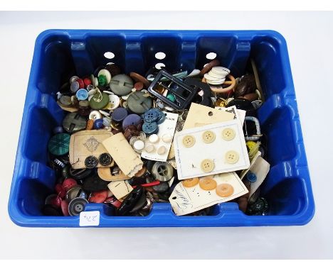 Large quantity vintage buttons and buckles, two wickerwork baskets containing needle cases, threads and other sewing items an