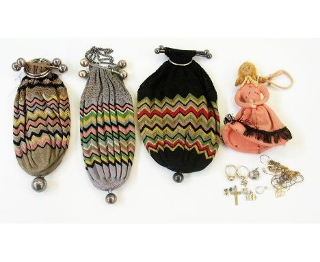 Three crocheted purses of geometric design with silver plated ring and bar fastenings, a felt purse in the form of a doll and