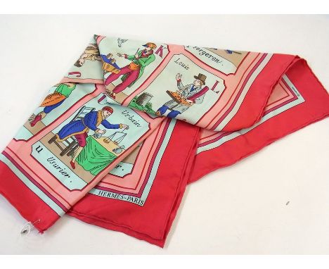 A silk scarf marked "Hermes" showing various trades in alphabet form with a red border 