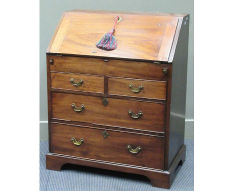 A George III flame mahogany bureau, the fitted interior with document well over two short and two long drawers on bracket fee