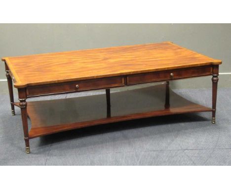 A Brights of Nettlebed two-tier mahogany coffee table with satinwood crossbanding, the rectangular top with two real and two 