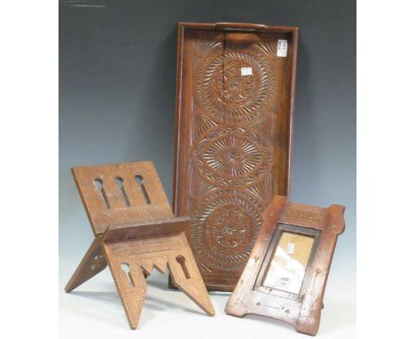 A chip carved tray (cracked), a small carved Koran stand, and Art Nouveau easel back photo frame
