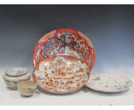 A Japanese Kutani basin (rubbed), a Kutani charger, a Nabeshima style charger, a tea bowl with impressed mark of Ninsei (dama