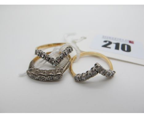 A Wishbone Style Ring, claw set, stamped "750" (finger size N); together with another ring similar; and a five stone ring, il