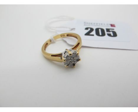 A Modern Diamond Cluster Ring, of flowerhead design, claw set with uniform brilliant cut stones, stamped "0.25" "18KT" (finge
