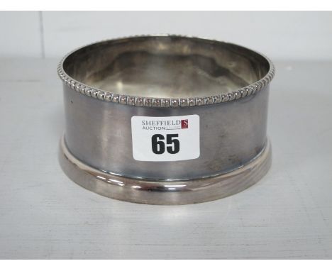 A Modern Hallmarked Silver Bottle Ring, Ken Taylor, Sheffield 2003, of plain design with beaded edge, 11cm diameter (160grams