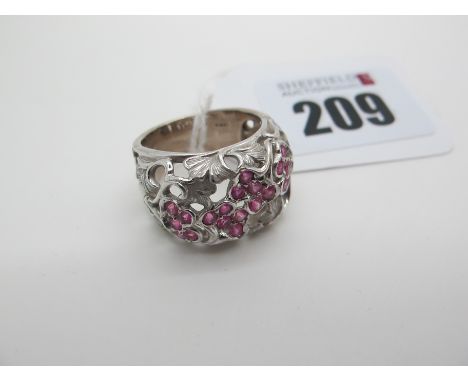 A Modern Decorative Cocktail Dress Ring, of openwork foliate design, with inset highlights, stamped "750" (finger size M) (10