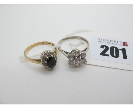 A Modern 9ct White Gold Zirconia Set Cluster Ring, claw set (finger size R); A 9ct Gold Cluster Ring, (finger size R). (2) 