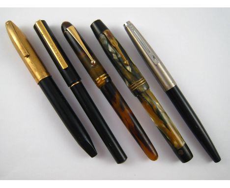 A Sheaffer pen together with four various pens, including a Manuscript. 