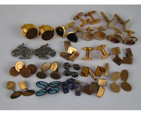 A mixed lot comprising nineteen pairs of cufflinks including enamel on white metal (tests silver).
