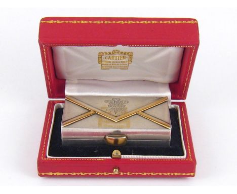 Cartier. A Cartier silver heavy stamp box in the form of an envelope with yellow metal thumbpiece and "edges" to the "paper",