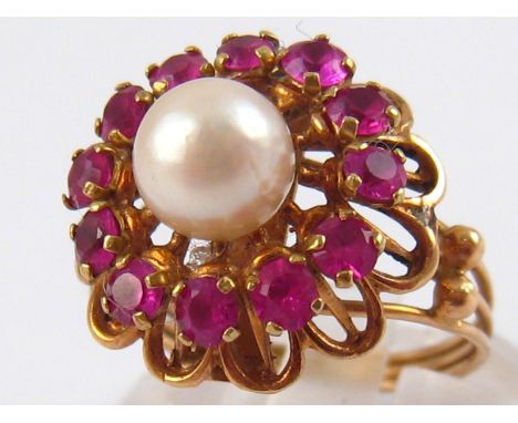 A yellow metal (tests 14 carat gold) ruby and cultured pearl ring, pearl approx 6.8mm diameter, ring size M, 4 gms.