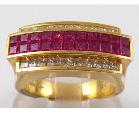 A fine yellow metal (tests 18 carat gold) ruby and princess cut diamond ring, size O, 12.8 gms.
