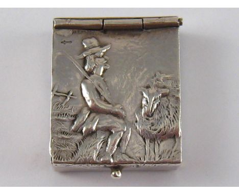 A Dutch 833 standard silver double sided stamp box with embossed bucolic scenes.2x2.5cm. 