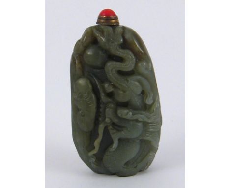A Chinese jade snuff bottle carved with a dragon, lotus and cloud. 8x4cm. 