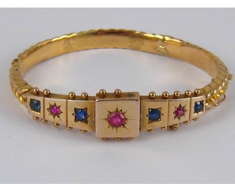 An antique 15 carat gold bangle, internal width approx. 6cm, weight approx. 16.3 gms.
