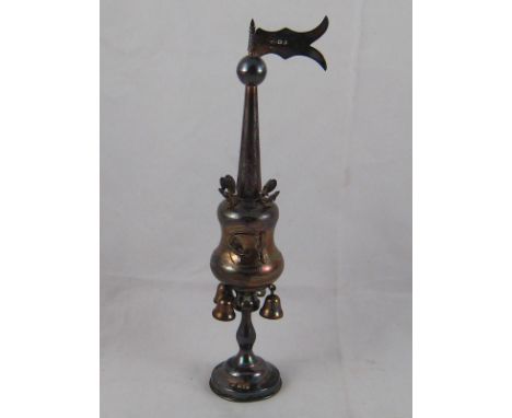 A silver spice tower , the waisted round body with four bells on baluster stem , a round steeple rising to a ball finial with