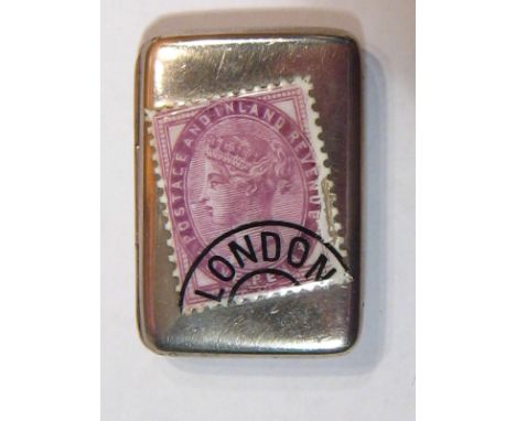 A late Victorian silver envelope type stamp case with enamelled Victorian postmarked postage stamp. 3.5x2.5cm. 